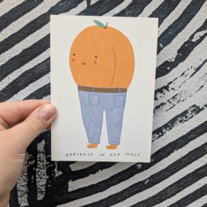 Aprikose in der Hose Postkarte von Caroline Frett